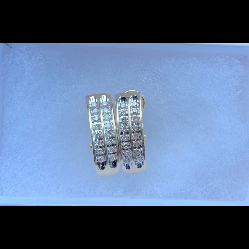 Solid 10k gold genuine diamond channel earrings.